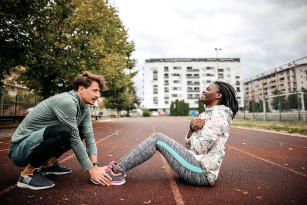 istock Friends do warm-up exercises 1342279376