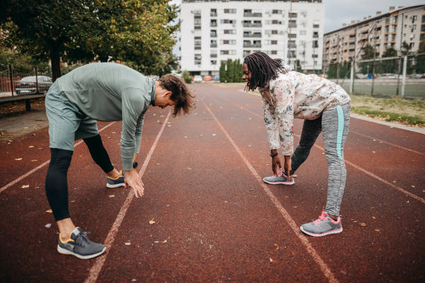 istock Friends do warm-up exercises 1342279386