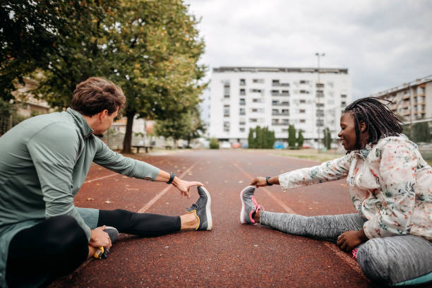 istock Friends do warm-up exercises 1342279460