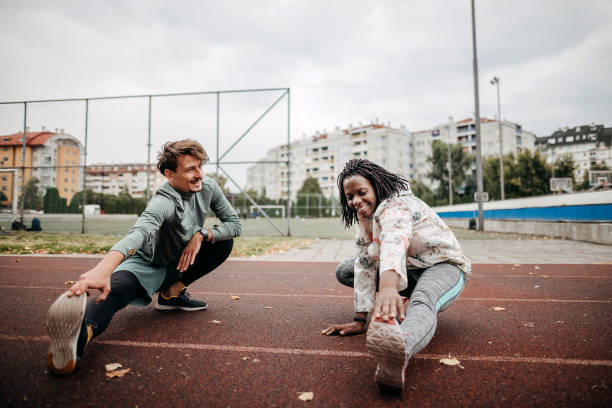 istock Friends do warm-up exercises 1342280289