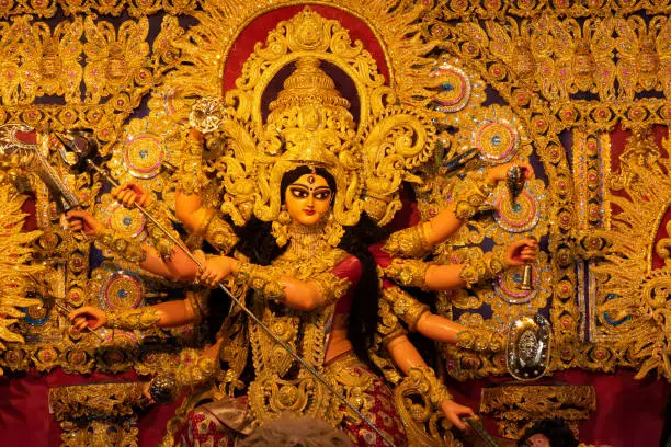 Goddess Durga idol decorated at puja pandal in Kolkata, West Bengal, India. Durga Puja is biggest religious festival of Hinduism and is now celebrated worldwide.