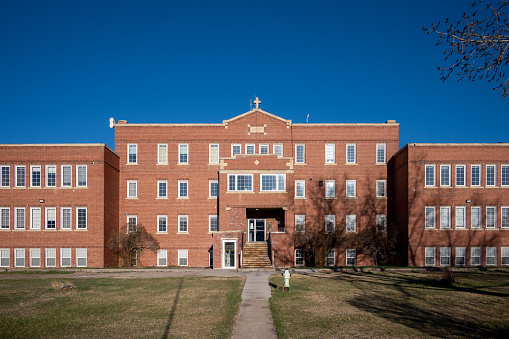 Siksika Nation, Alberta - May 2, 2021: Old Sun Community College formerly operated as an Indian Residential School from 1929-1971. Today it is a bustling, multi-purposed, learning facility.