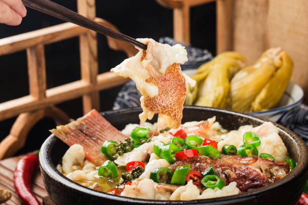 Chinese food:boiled fish with pickled cabbage and chili. Red grouper fillets