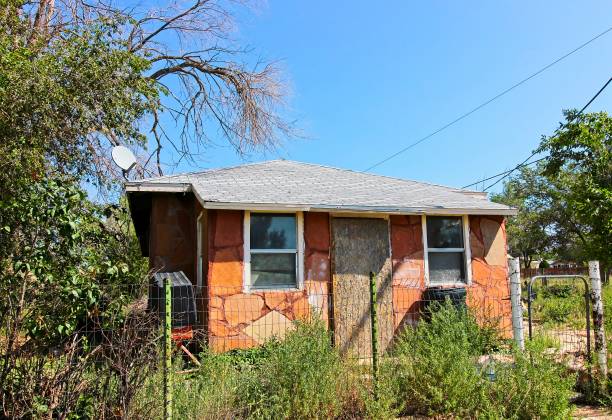 istock Abandoned Flagstone Front House With Boarded Up Entrance 1342284386