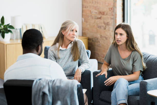 istock Mom is angry as daughter talks to therapist 1342284431