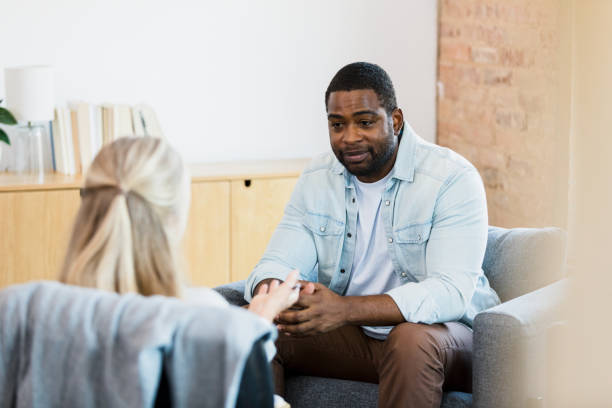 istock Man hopeful as he listens to unrecognizable therapist 1342284469
