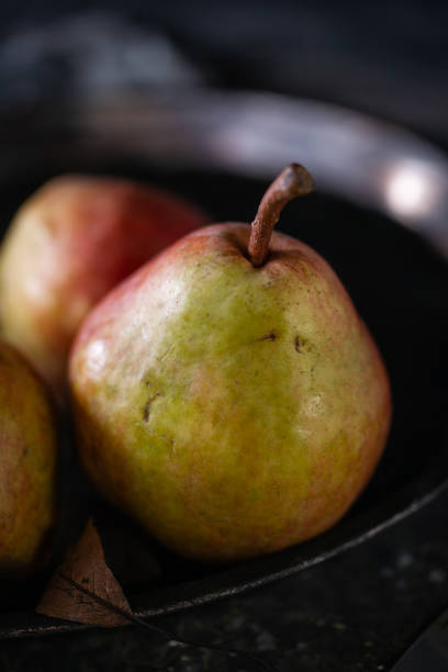 Autumn pears on the dark rustic background