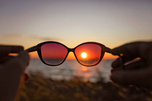 istock Brilliant yellow sunset through stylish sun glasses 1342299134