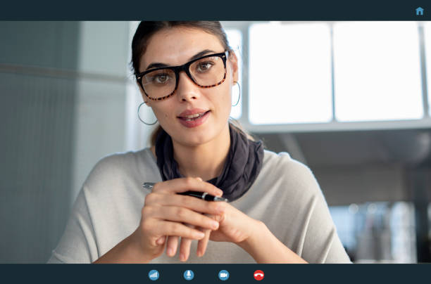 istock Young woman talking to webcam 1342299277