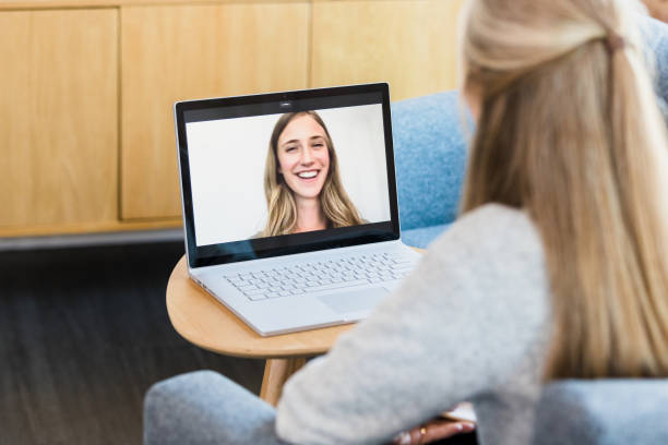 istock Young woman discusses success during virtual therapy session 1342300645