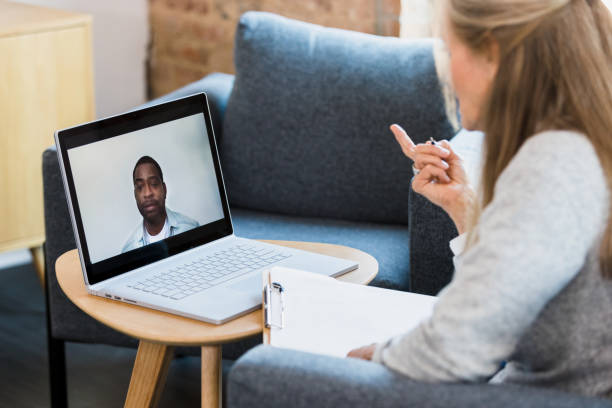 istock Man listens during online therapy appointment 1342300647
