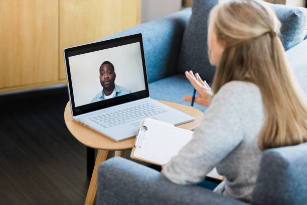 istock Man listens to therapist during online therapy session 1342300652