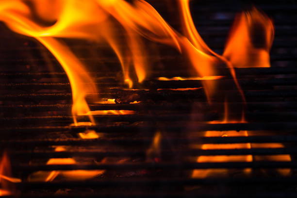 Empty hot charcoal barbecue grill with bright flame