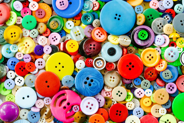 istock Colorful mixed sewing buttons background. Top view 1342307700