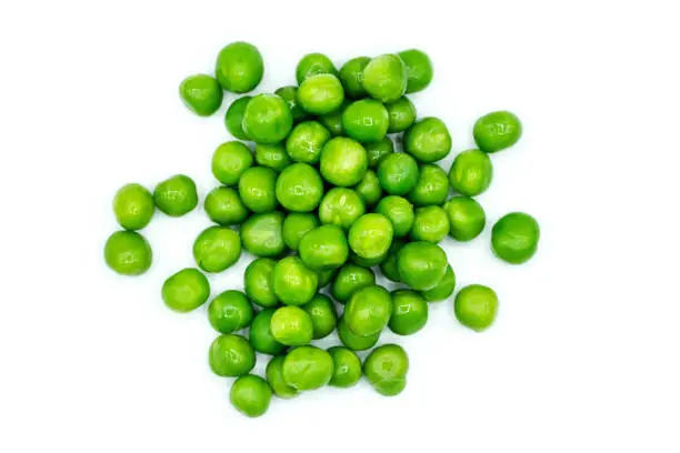Green peas isolated on white background top view