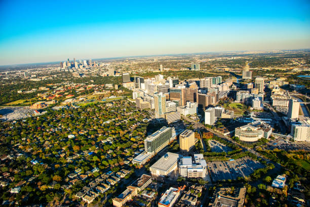 Above Houston's Medical Center The Medical Center area of Houston, Texas shot from an altitude of about 1000 feet showing the city's downtown in the distance. medical building stock pictures, royalty-free photos & images