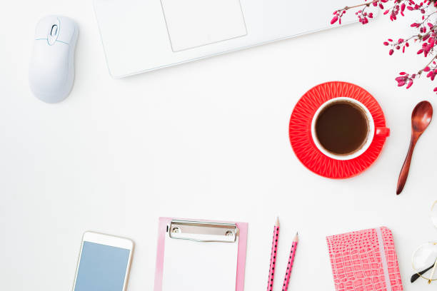istock Flat lay composition with cup of coffee, branches with red berries, laptop on a white background 1342313050