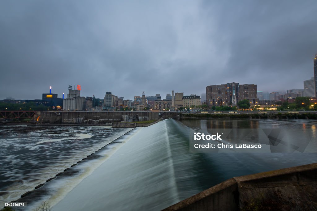 Saint Anthony Falls at Dusk The Minneapolis skyline and Saint Anthony Falls Arch - Architectural Feature Stock Photo