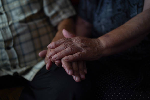 istock Senior couple holding hands supporting each other 1342319026