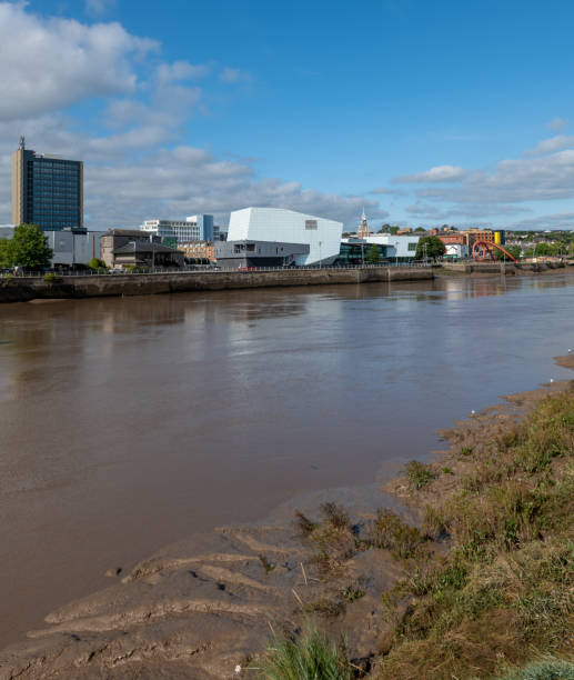 Newport, UK. Wednesday 22 September 2021. View down the River Usk in Newport, Wales with businesses and houses on the riverbank.