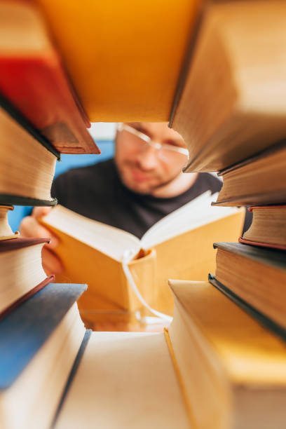 istock stack of old dusty library books - concept of reading literature 1342324251