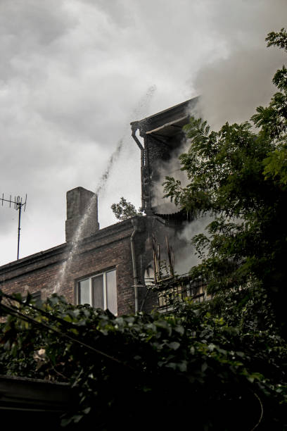 istock Fire in a residential five-story building. Firefighters extinguish the fire with water from a gunboat. 1342330903