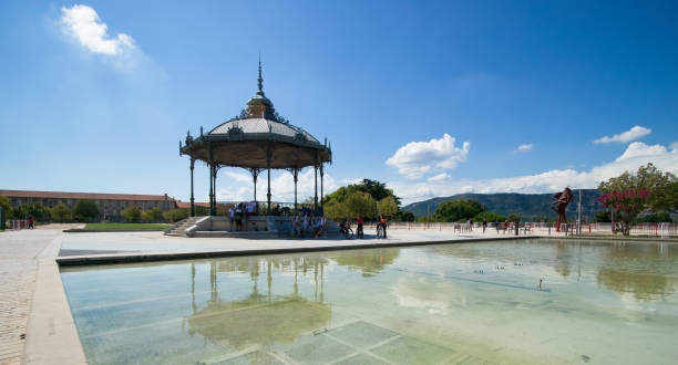 Peynet kiosk in Valence with reflection on the pond water Peynet kiosk in Valence with reflection on the pond water valence drôme stock pictures, royalty-free photos & images