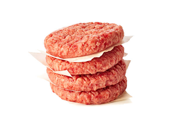istock Stack of raw burger patties on white background 1342341748