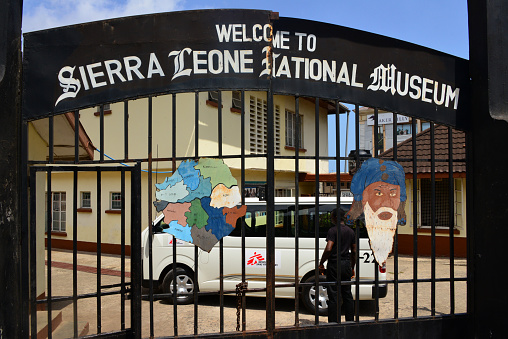 Freetown, Sierra Leone: entrance gate of the Sierra Leone National Museum on Pademba Road. Opened in colonial times (1957) as the museum of the Sierra Leone Society, a ‘learned society’ whose members included colonial officials and prominent members of Freetown’s Krio community.