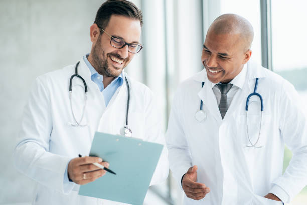 istock Two doctors talking at hospital 1342346322