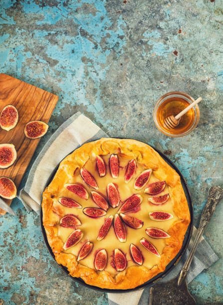 istock Freshly baked fig galette or open fig pie on rustic background 1342347243