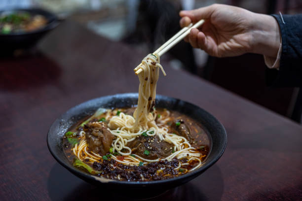 istock Pick up Chinese food with chopsticks 1342351048