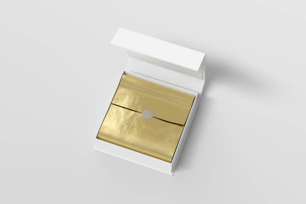 istock White opened square folding gift box mock up with gold wrapping paper on white background. View above. 1342354917