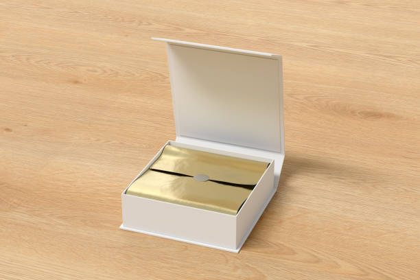 istock White opened square folding gift box mock up with gold wrapping paper on wooden background. Side view. 1342355425