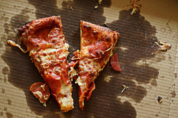 istock Two Pieces of Pizza in Original Cardboard Container 1342361053