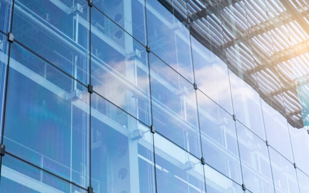 istock Sky and clouds reflected in a modern building glass facade 1342361852