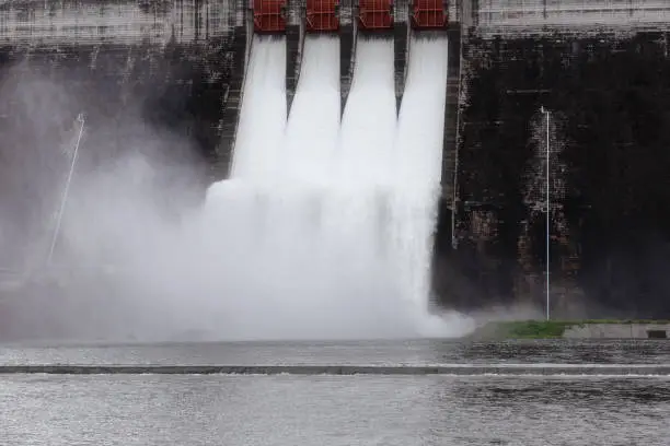 Photo of Water flowing over floodgates of a dam at Khun Dan Prakan Chon, Nakhon Nayok Province, Thailand