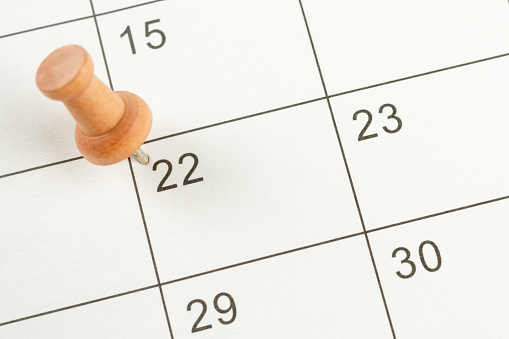 The concept of planning and deadline with push pin on calendar date.