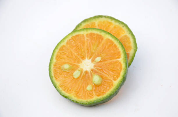 istock sliced orange fruit isolated on white background. 1342367901