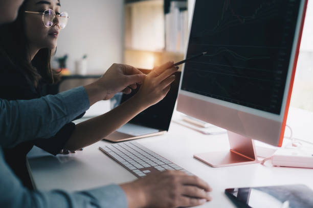 istock Business team working together and training to analyze technical price graph and indicator. Chart and stock trading computer screen. 1342367942