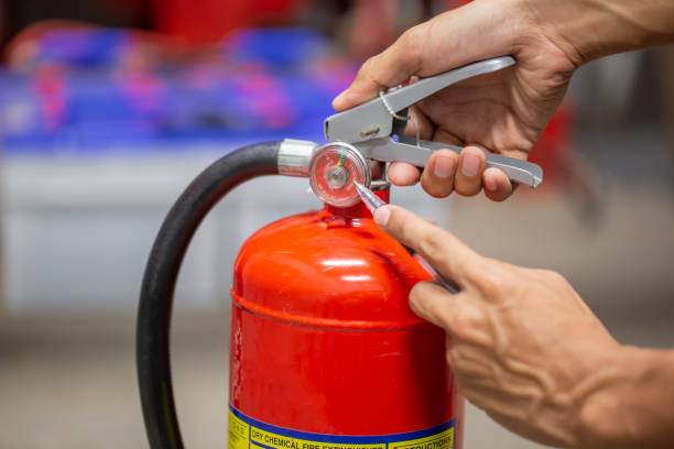 istock Engineer are checking and inspection a fire extinguishers tank in the fire control room for safety training and fire prevention. 1342371337