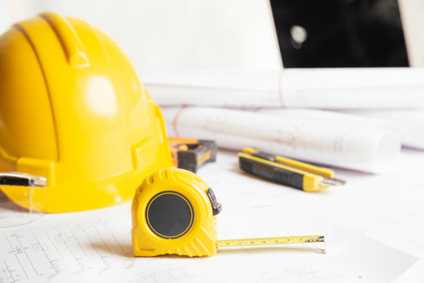 istock Work safety. Standard Construction site protective equipment on table wooden background, flat lay, copy space,safety first concepts. 1342371409