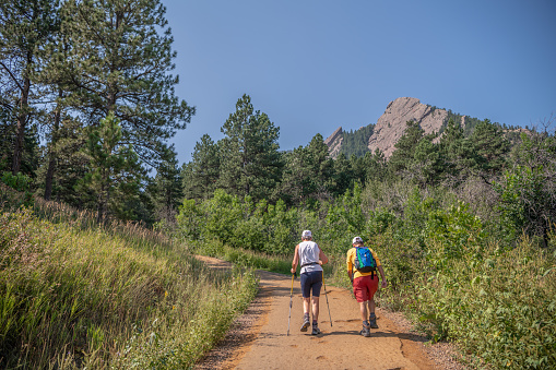 Boulder, CO - August 29, 2021: A senior couple hikes at the famous Chautauqua Park Hiking area.