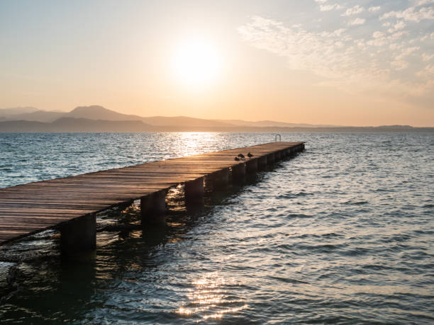 istock Lake Garda Jetty at Sunrise at Sirmione 1342388587