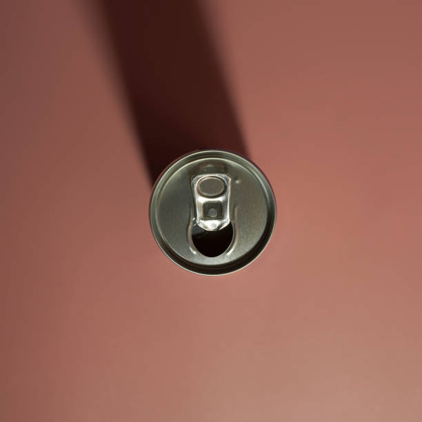 istock An open can of a drink. On a pink background with a shadow. Square format 1342389860
