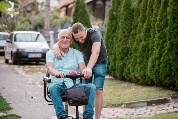 istock Senior man with a disability with son 1342392373