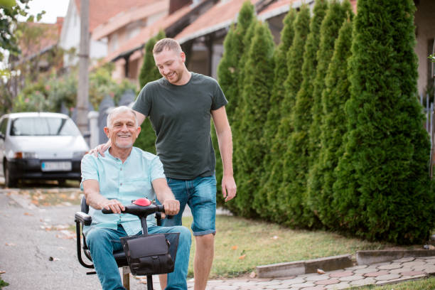 Grandfather with grandson spends quality time outside stock photo