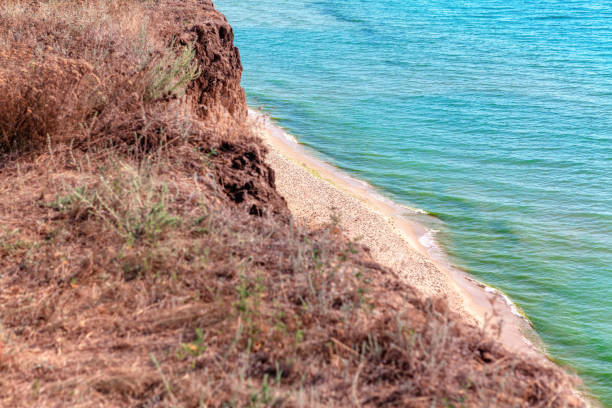 Sea shore view from the cliff . Seaside with sandy beach , view from above