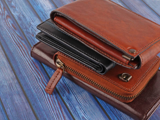 istock New leather multicolored wallets on blue wooden background 1342399338