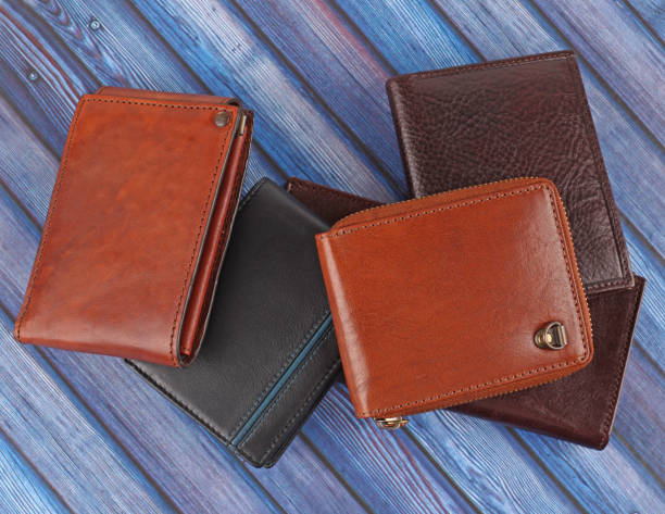 istock New leather multicolored wallets on blue wooden background 1342399346